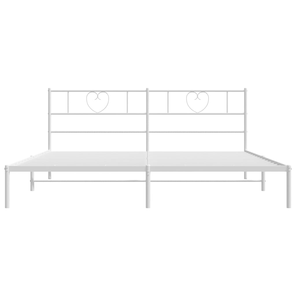 White metal bed frame with heart detail headboard and mattress