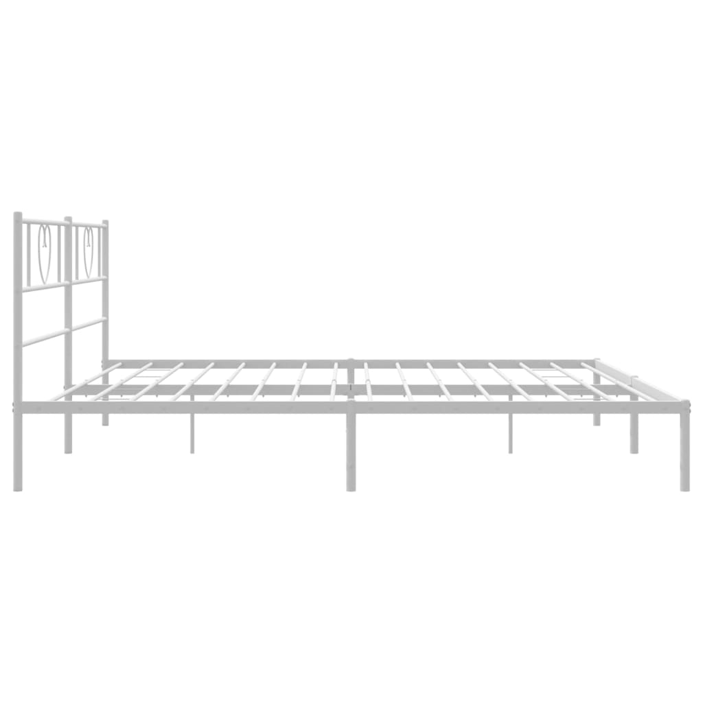 White metal bed frame with heart headboard details