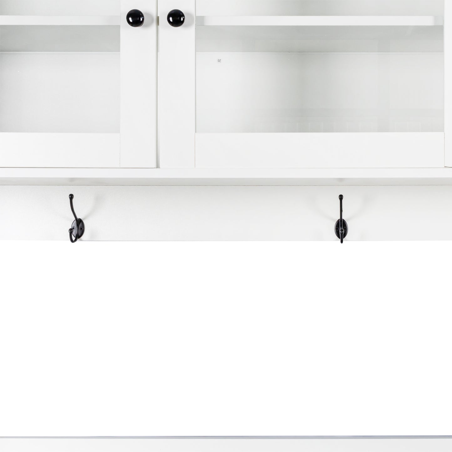 White cabinet with glass doors and black knobs