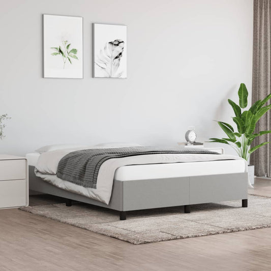 Upholstered twin bed frame in light gray fabric with black legs featuring a minimalist design for modern bedrooms