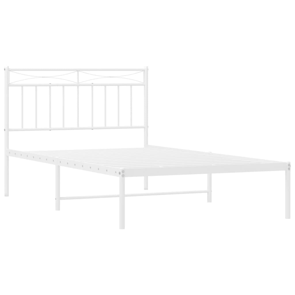 White metal twin bed frame with a decorative headboard