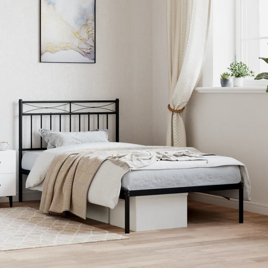 Black metal twin bed frame with ornamental headboard