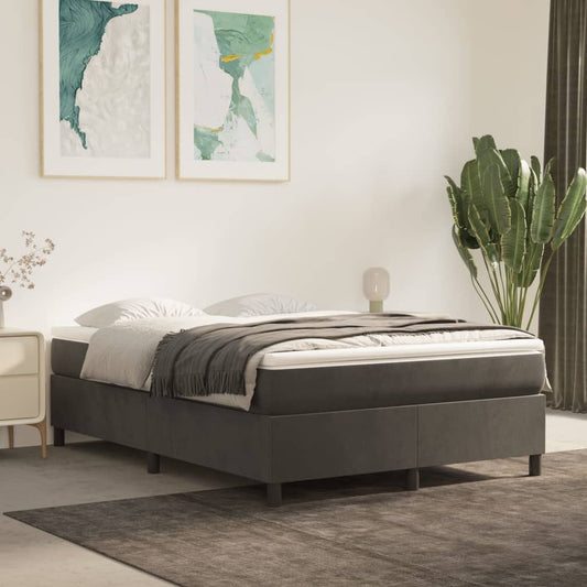 Dark grey upholstered divan bed base with wooden legs and a white mattress