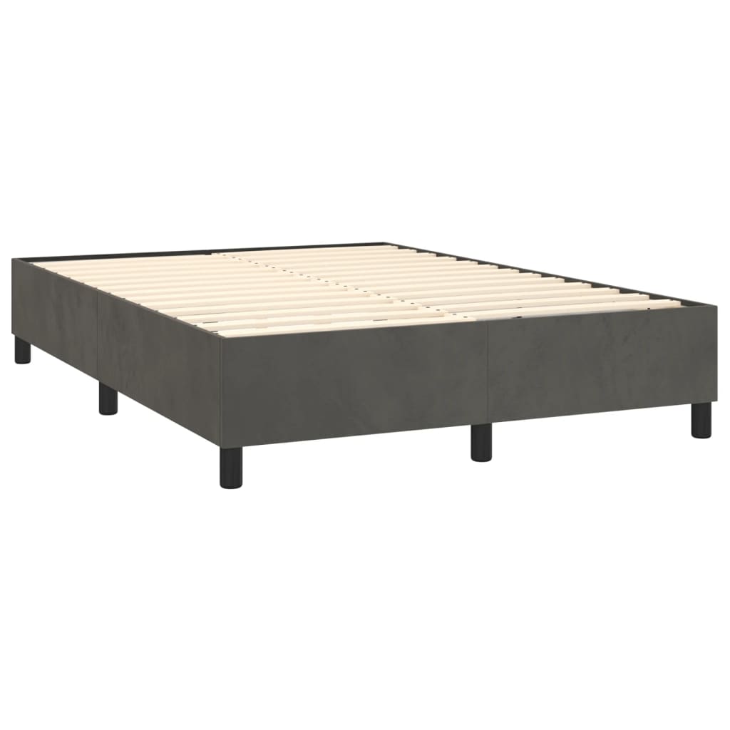 Dark gray upholstered bed frame with white mattress