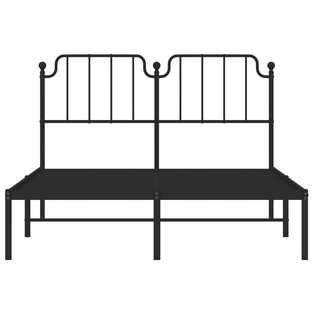 Black metal bed frame with ornate headboard and white mattress