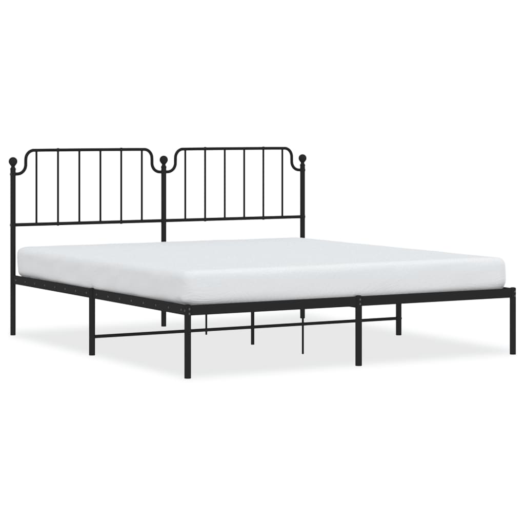 White metal bed frame with ornate headboard and slatted base