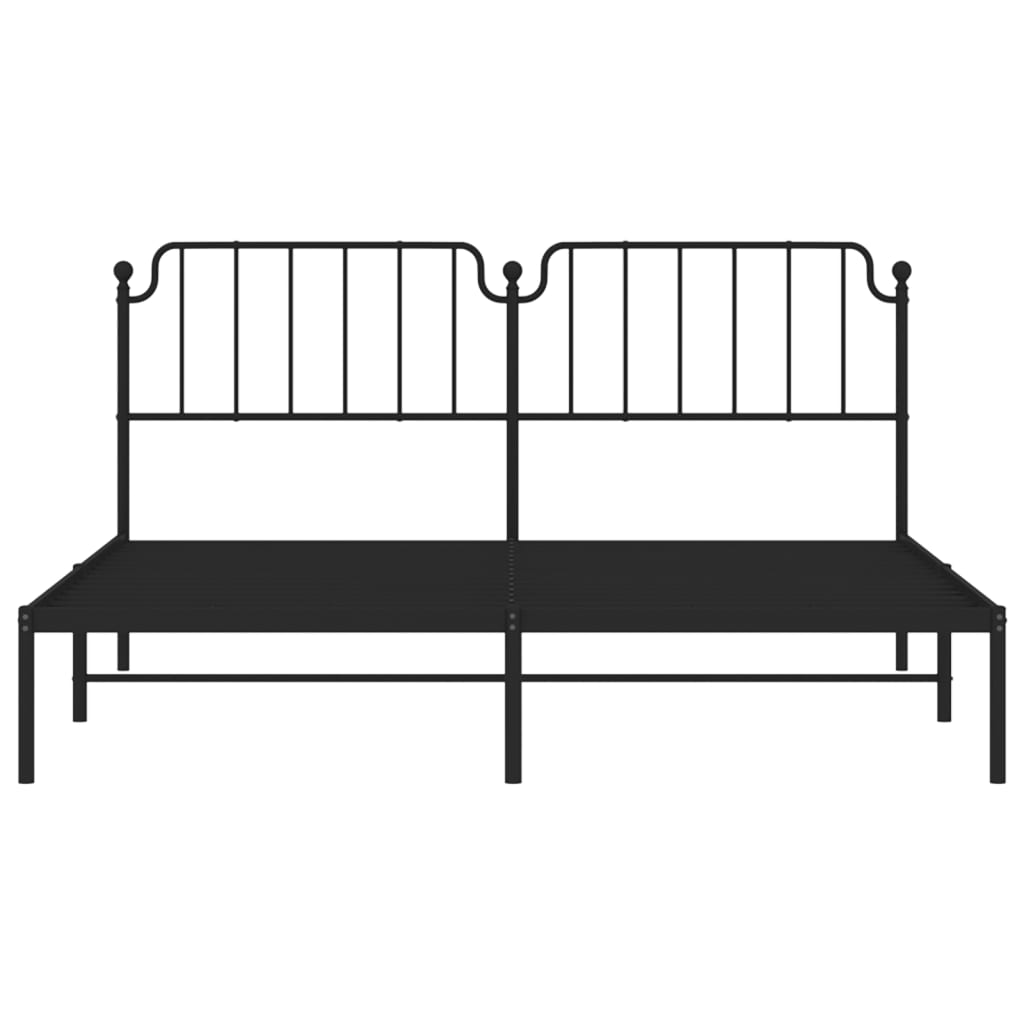 Black metal bed frame with ornate headboard and mattress support