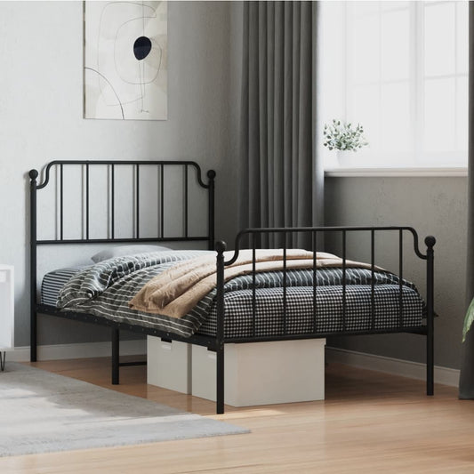 Black metal twin bed frame with ornate headboard and footboard
