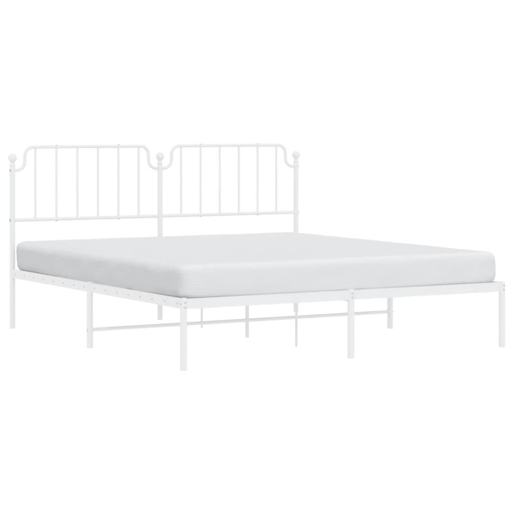White metal bed frame with ornate headboard and included mattress
