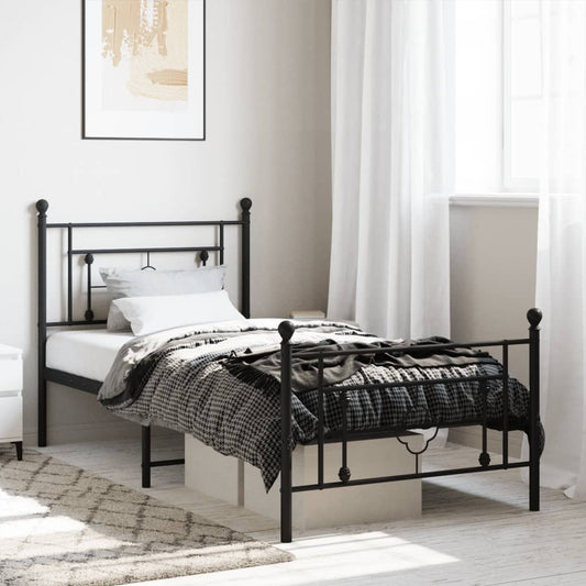 Black metal twin bed frame with decorative scrollwork on headboard and footboard