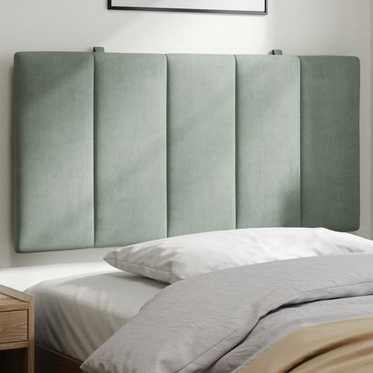 Sage green upholstered headboard with vertical paneling