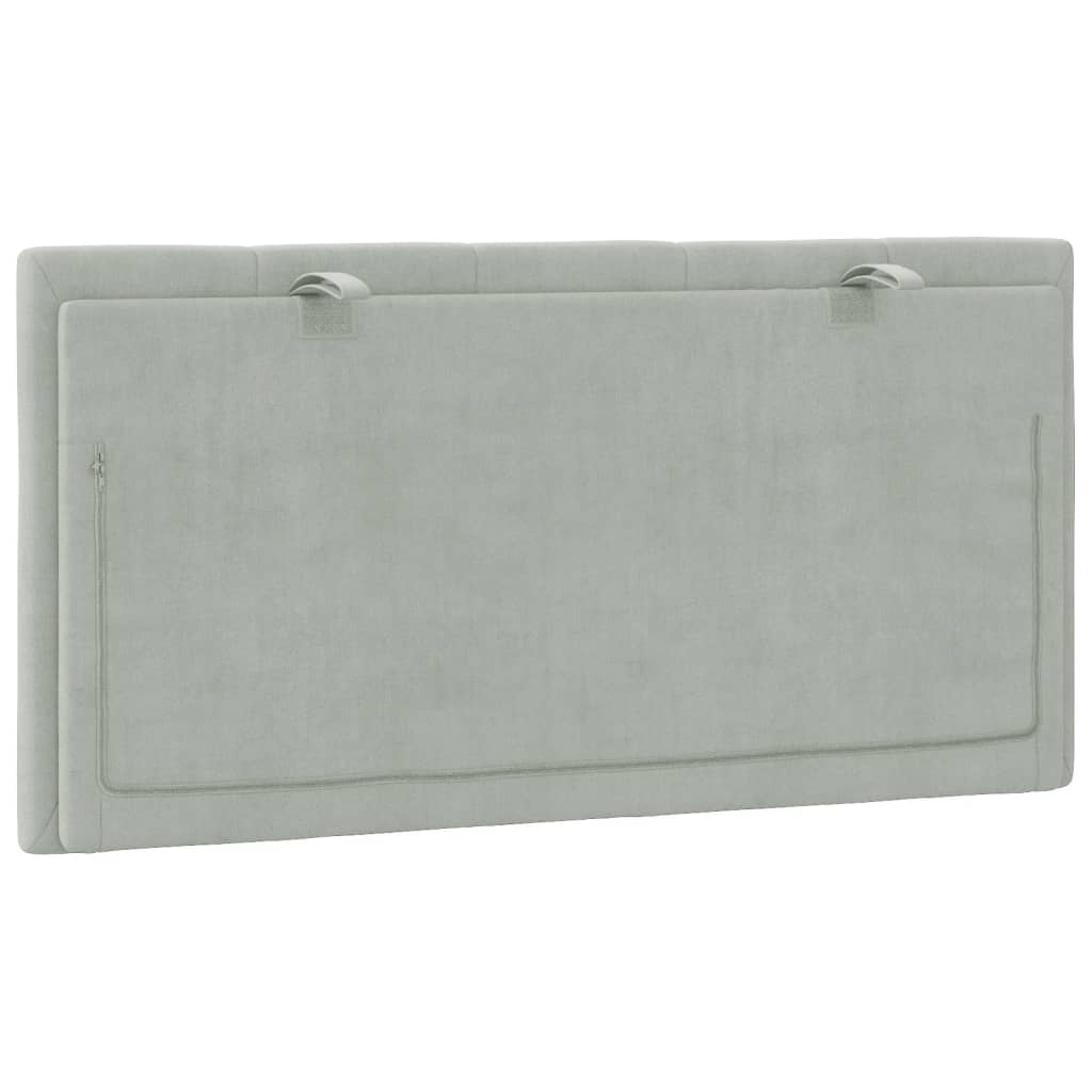 Light grey upholstered headboard with vertical channel tufting