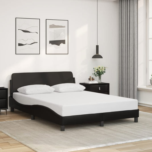 Black upholstered bed frame with a curved headboard and two white pillows