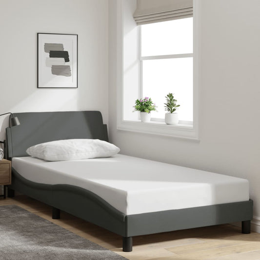 Single size memory foam mattress with upholstered grey bed frame