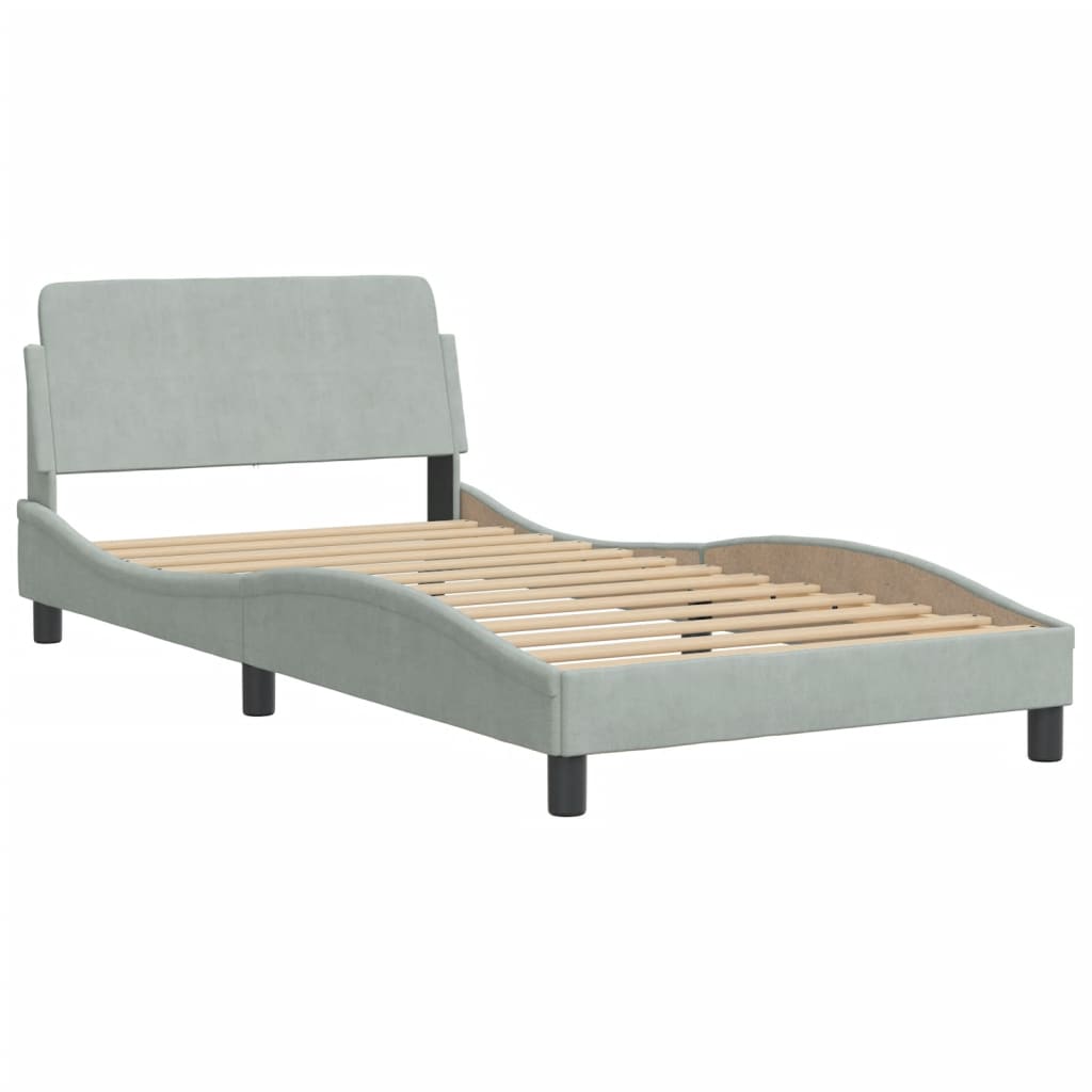 Pale gray upholstered single bed frame with padded headboard and wooden slats