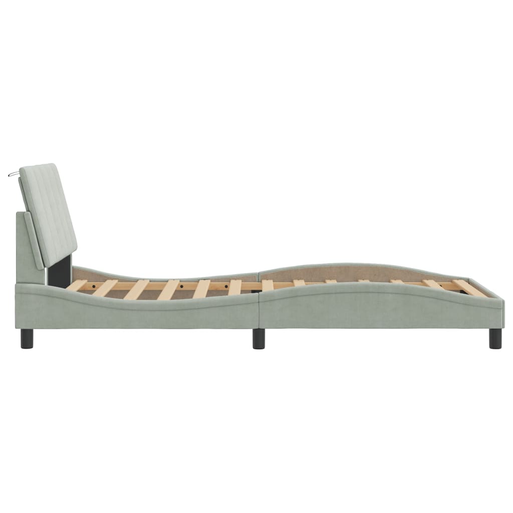 Light grey upholstered twin bed frame with a tufted headboard
