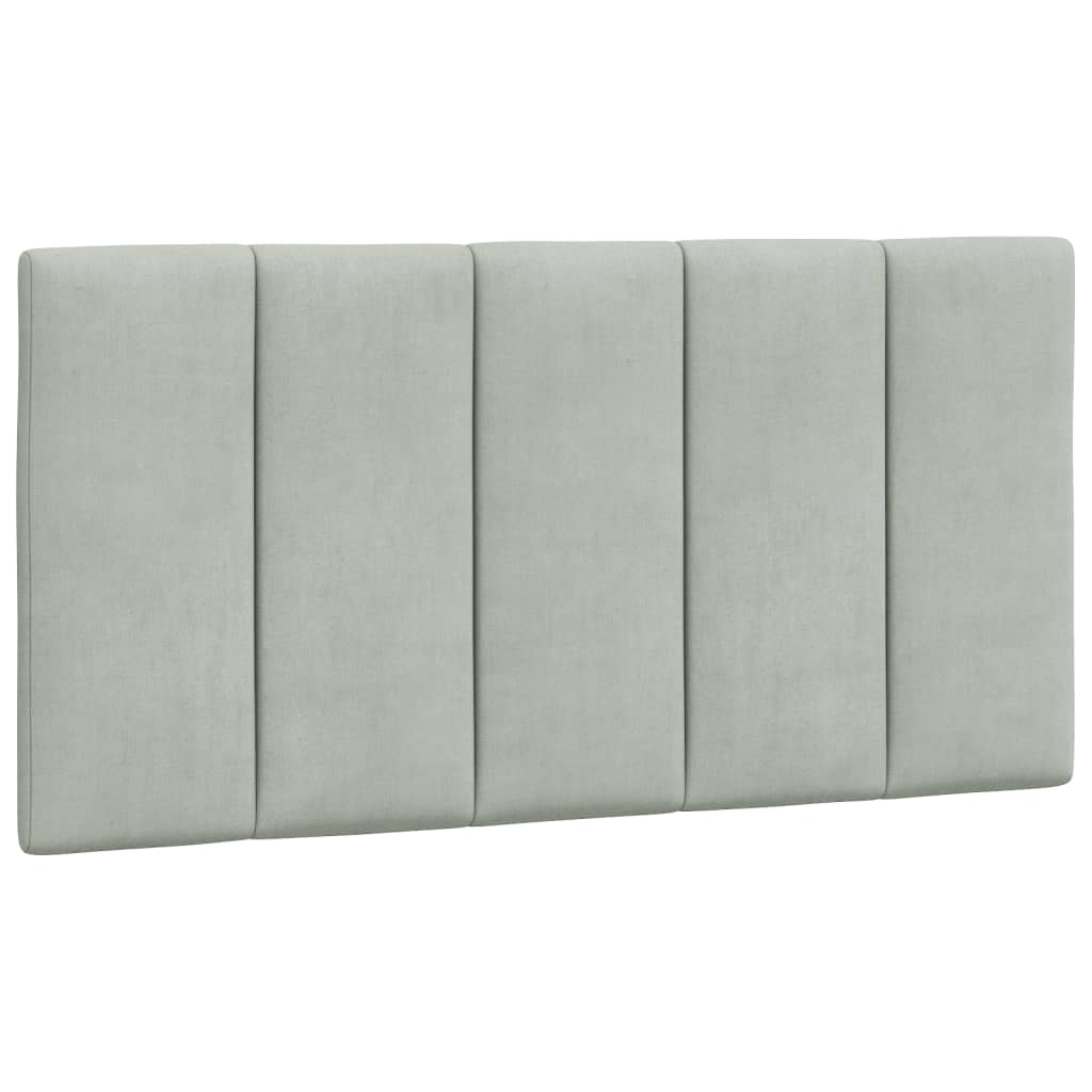 Light gray fabric upholstered bed frame with curved silhouette and wooden slats