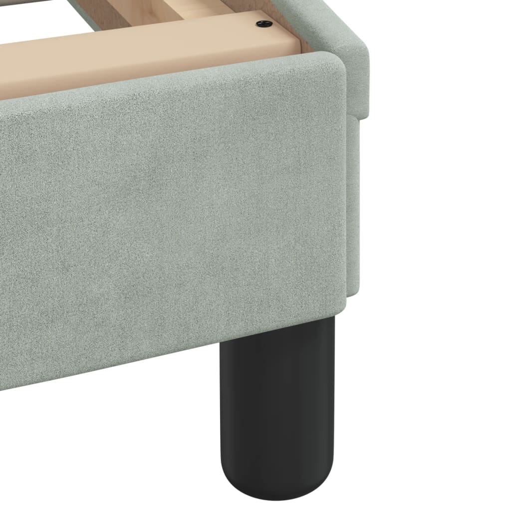 Light grey upholstered headboard with vertical tufting
