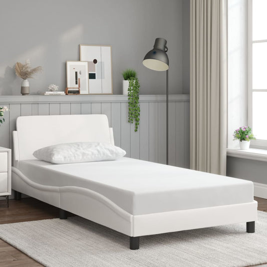 White upholstered twin bed frame with a minimalist design and headboard