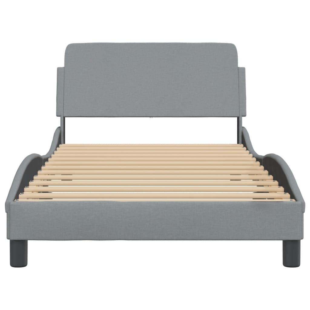 Grey upholstered platform bed frame with curved headboard and wooden slats
