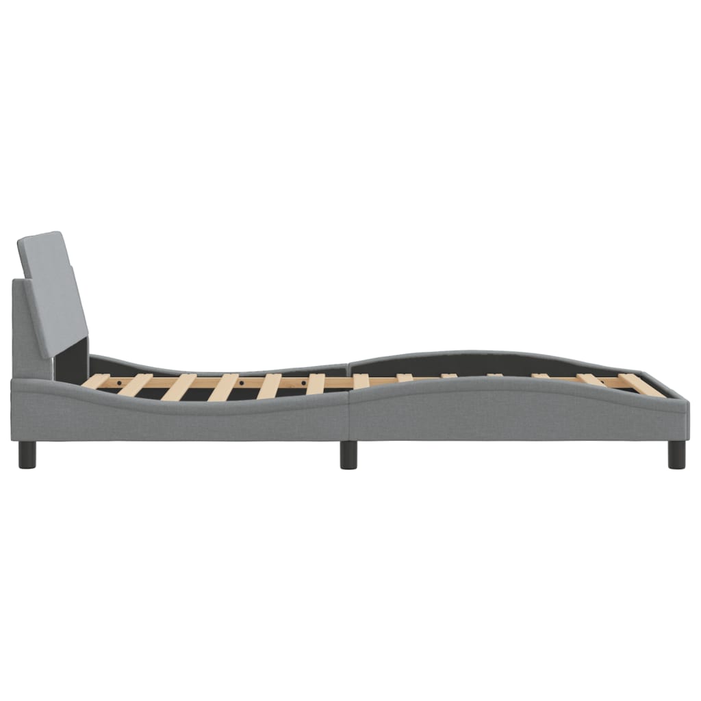 Grey upholstered bed frame with curved headboard and wooden slats