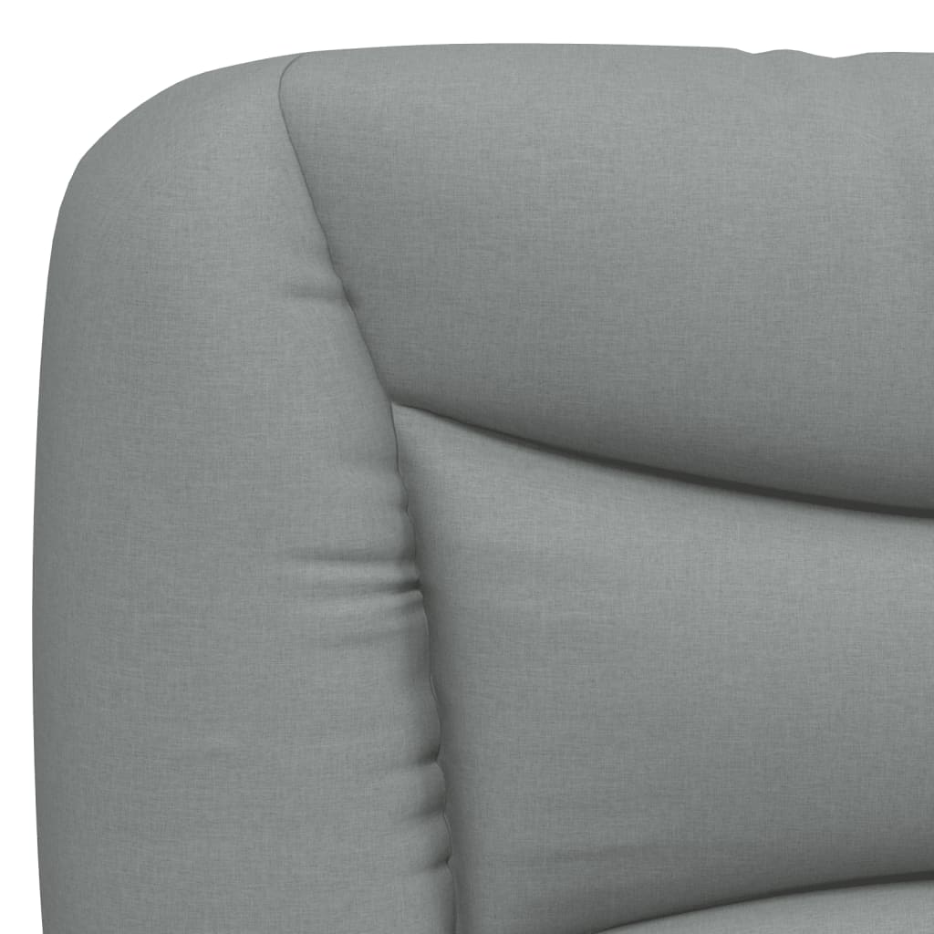 Gray upholstered headrest with plush quilting