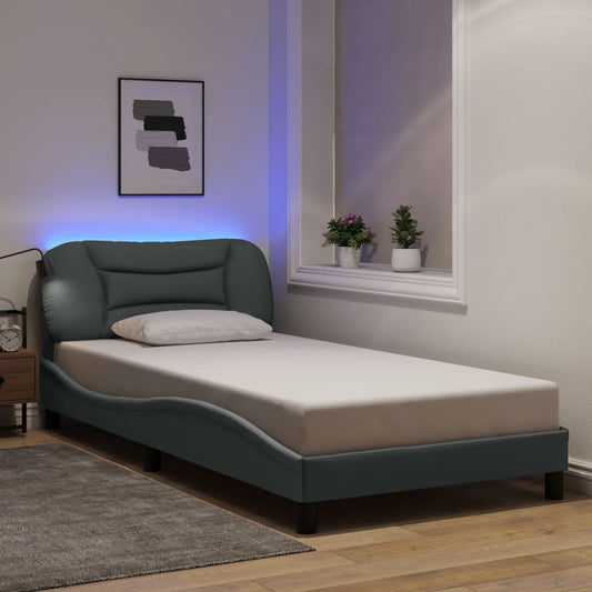 Dark grey upholstered single bed frame with curved headboard and integrated LED lighting