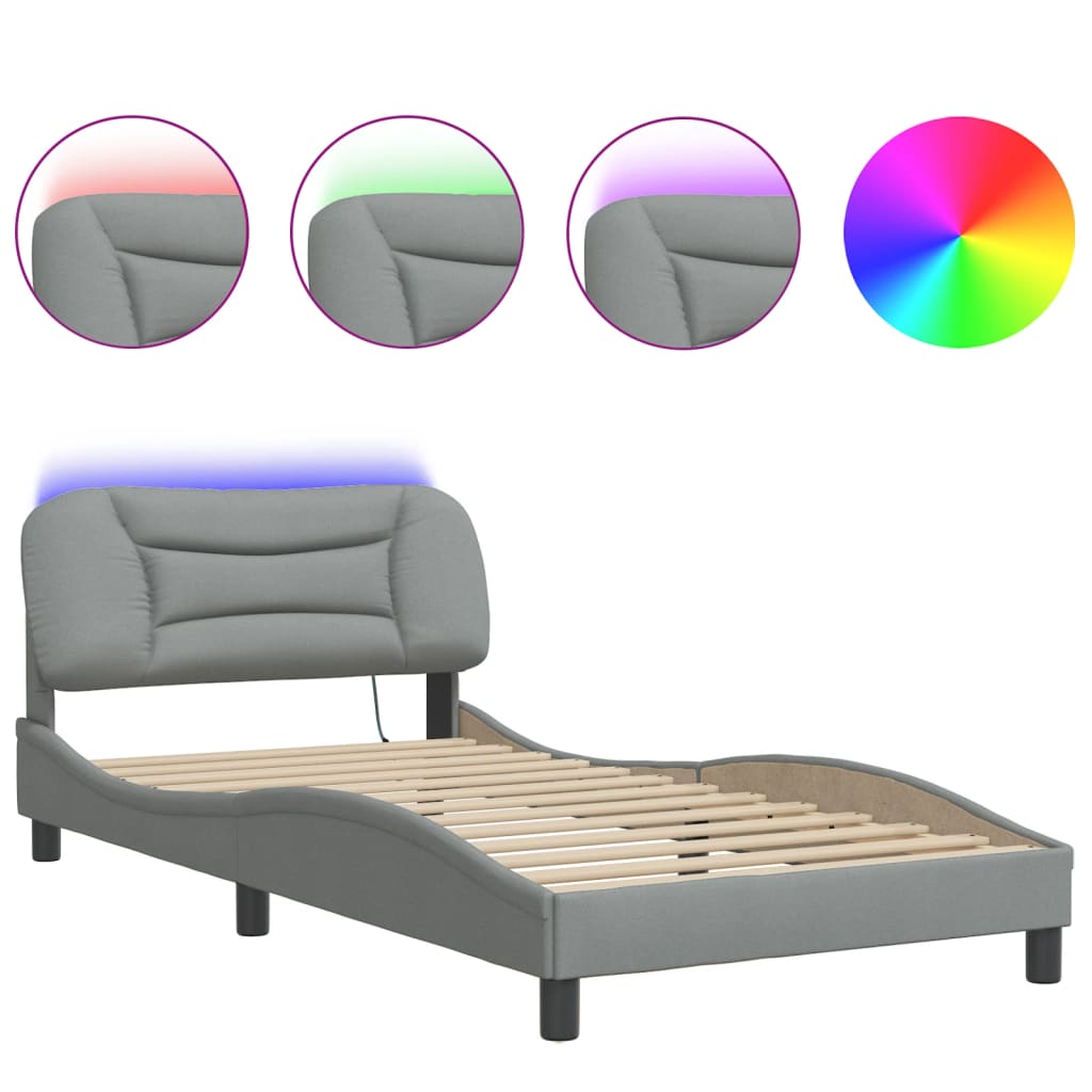 Closeup of a gray upholstered bed frame corner with a black cylindrical leg