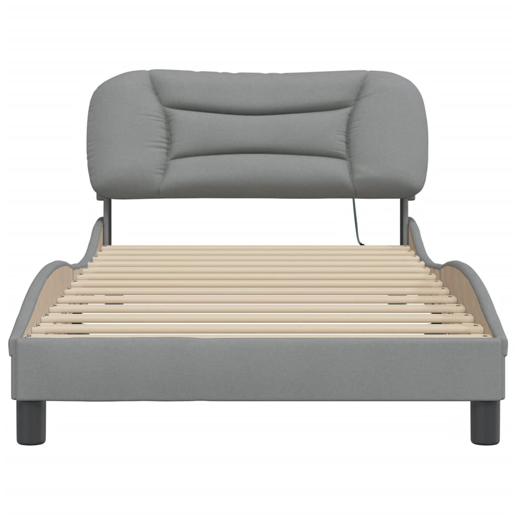 Grey upholstered single bed frame with a padded headboard