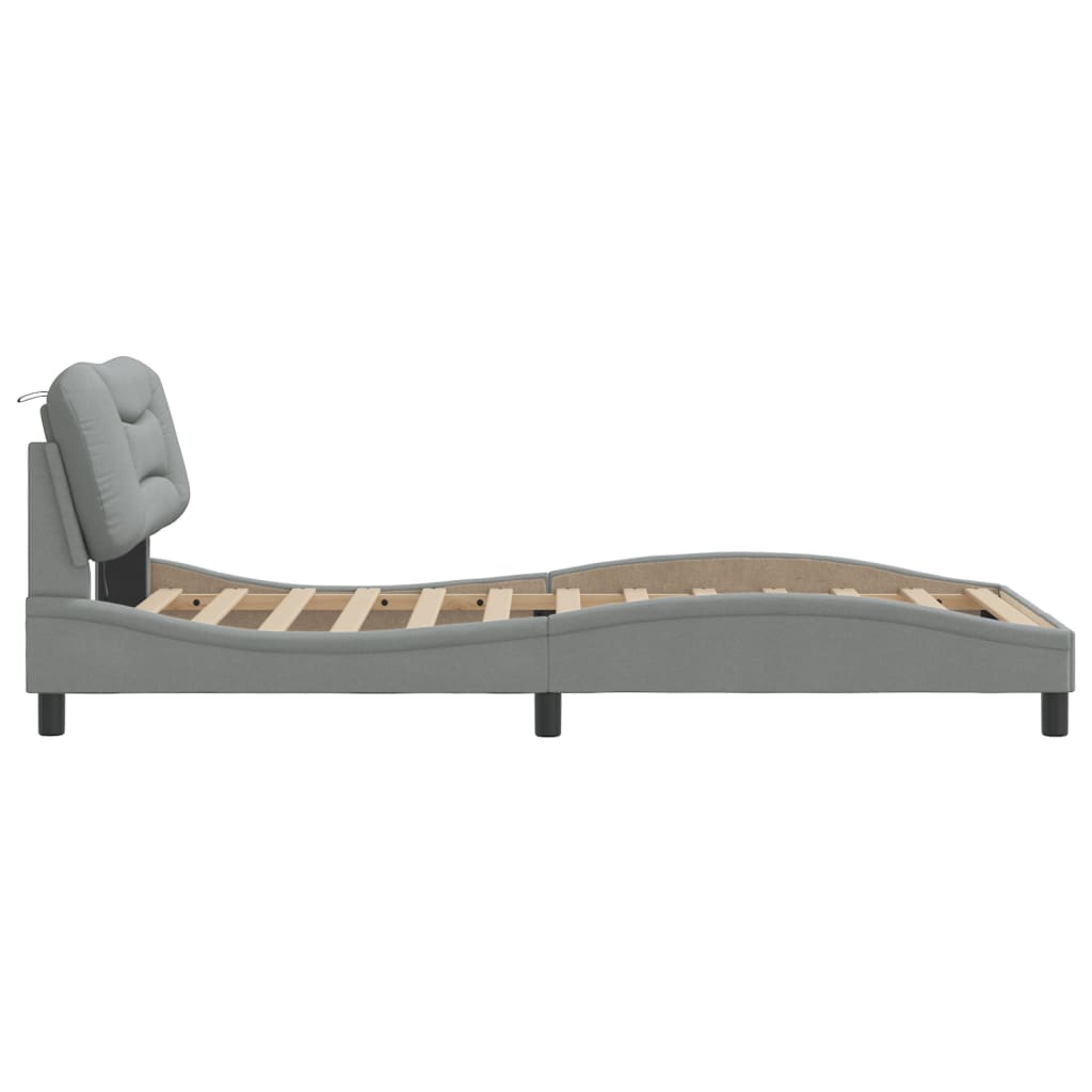Grey fabric bed frame with upholstered headboard and wooden slats