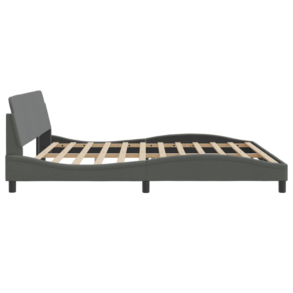 Upholstered grey bed frame with a slatted base and curved footboard