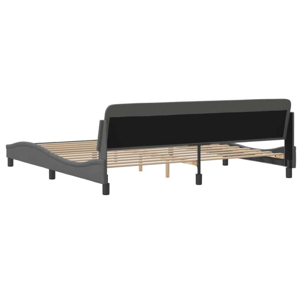 Dark gray upholstered platform bed frame with a curved headboard and wooden slats