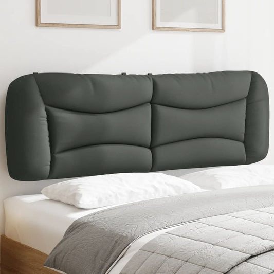 Dark grey upholstered headboard with curved stitching detail