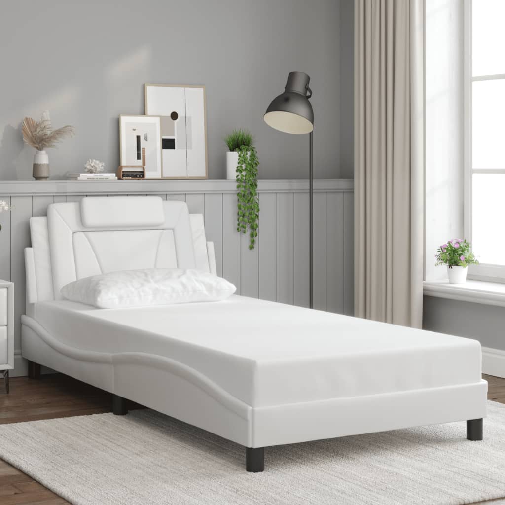 White faux leather bed frame with a unique headboard design and wooden slats