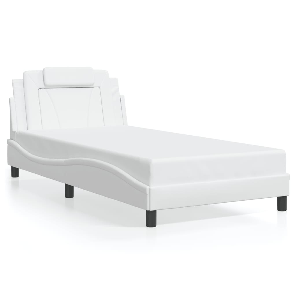 White faux leather chaise lounge with adjustable headrest and pillow