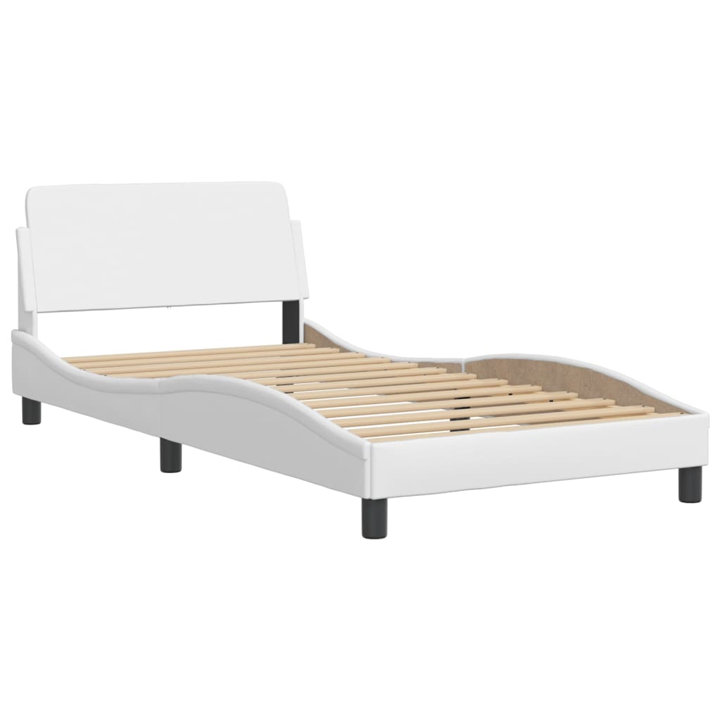 White upholstered bed frame with a padded headboard and slatted base