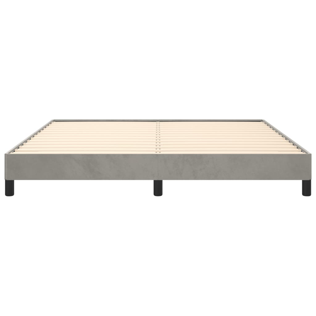 Low profile grey upholstered bed frame with wood slats