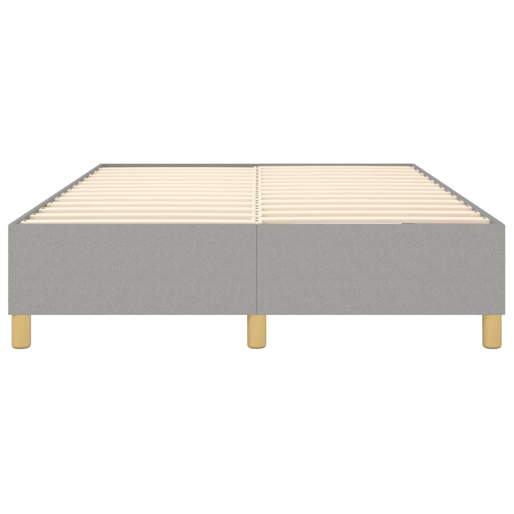 Grey upholstered platform bed frame with wooden slats and tapered legs