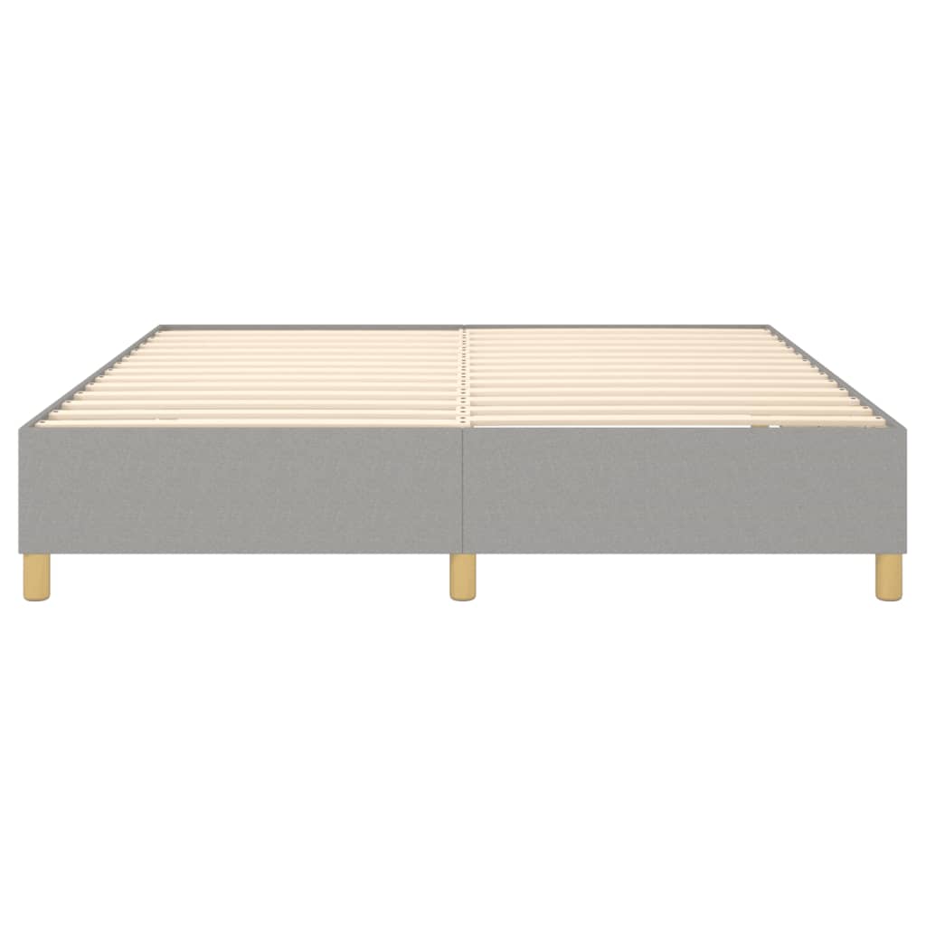 Grey fabric bed frame with wooden slats and gold legs