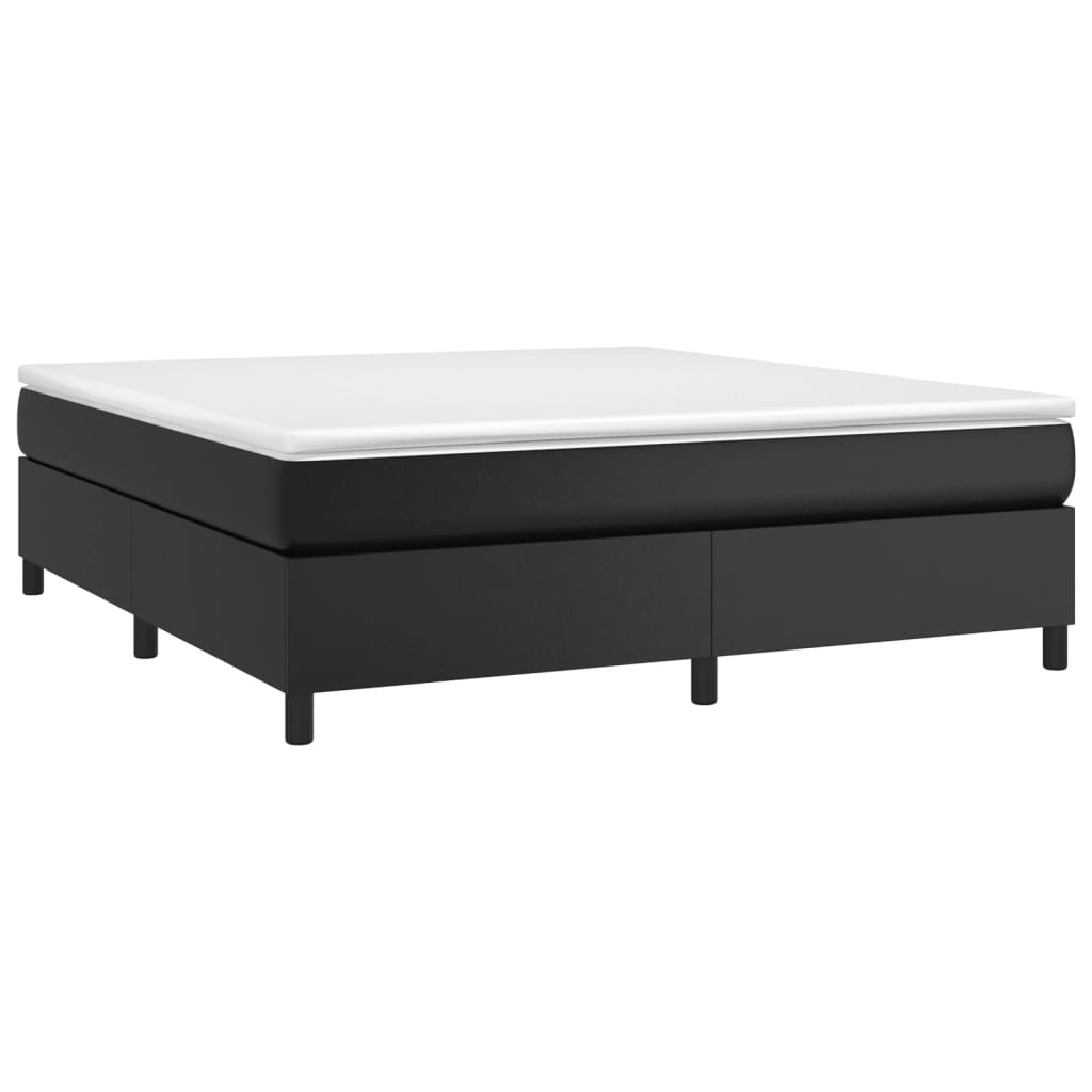 Black upholstered bed frame with white mattress