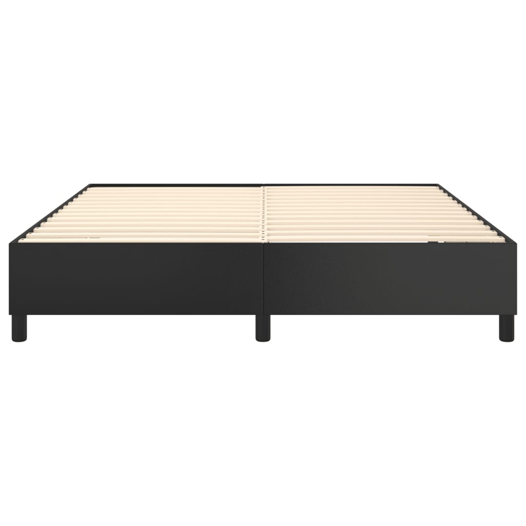 Minimalist black platform bed frame with wooden slats