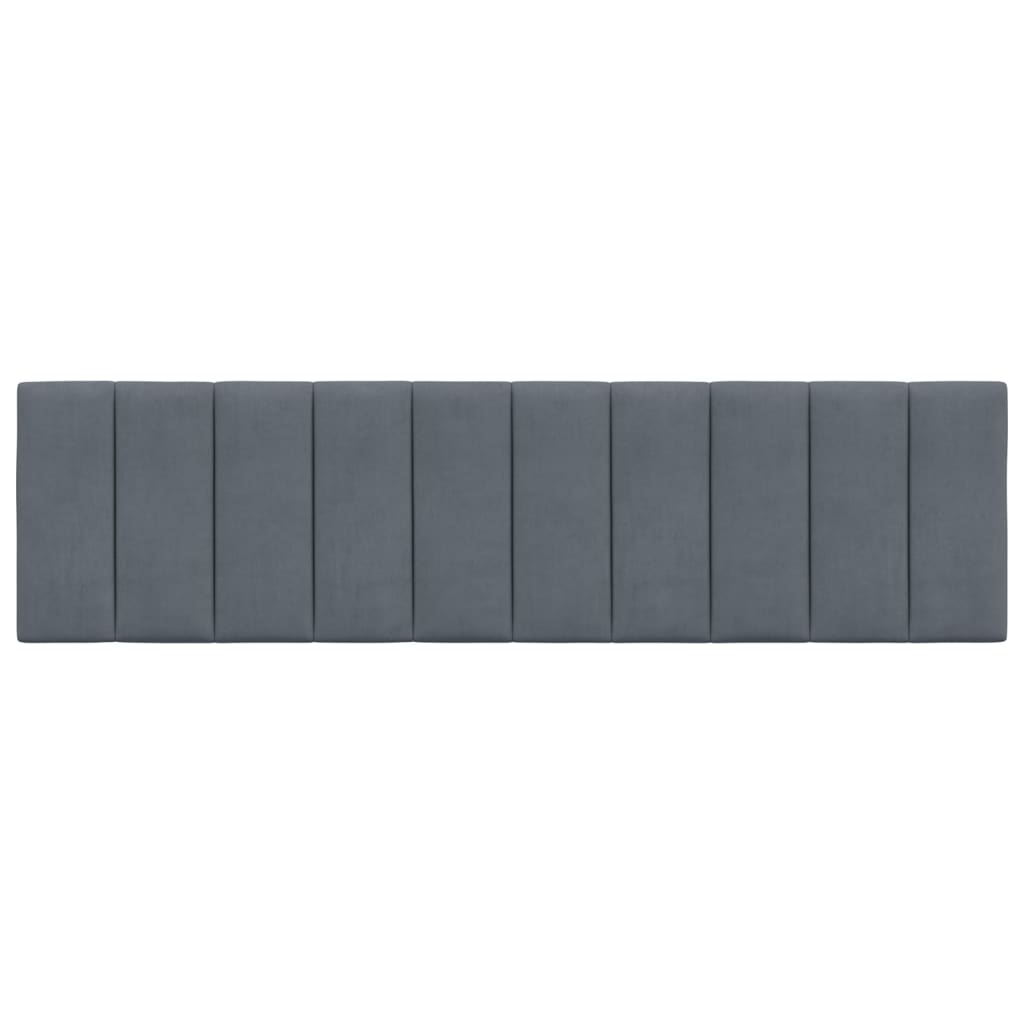 Upholstered dark grey headboard with vertical channel tufting for a modern bedroom