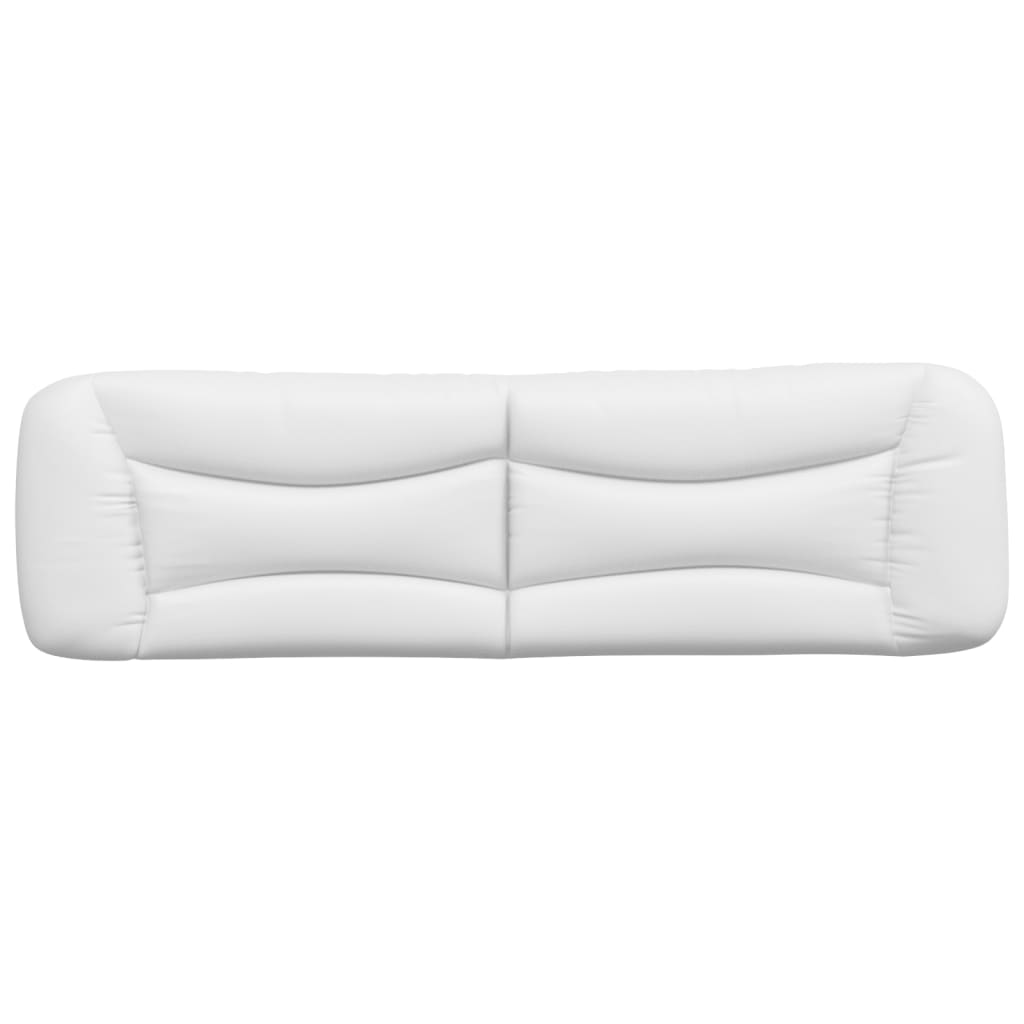 White faux leather headboard with tufted design mounted above a bed