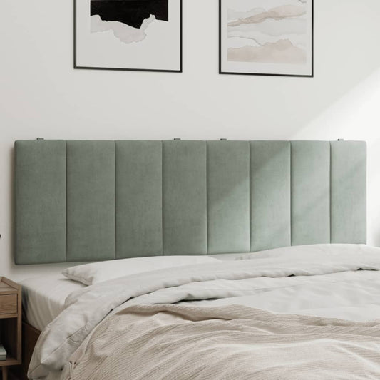 Sage green upholstered headboard with vertical tufting