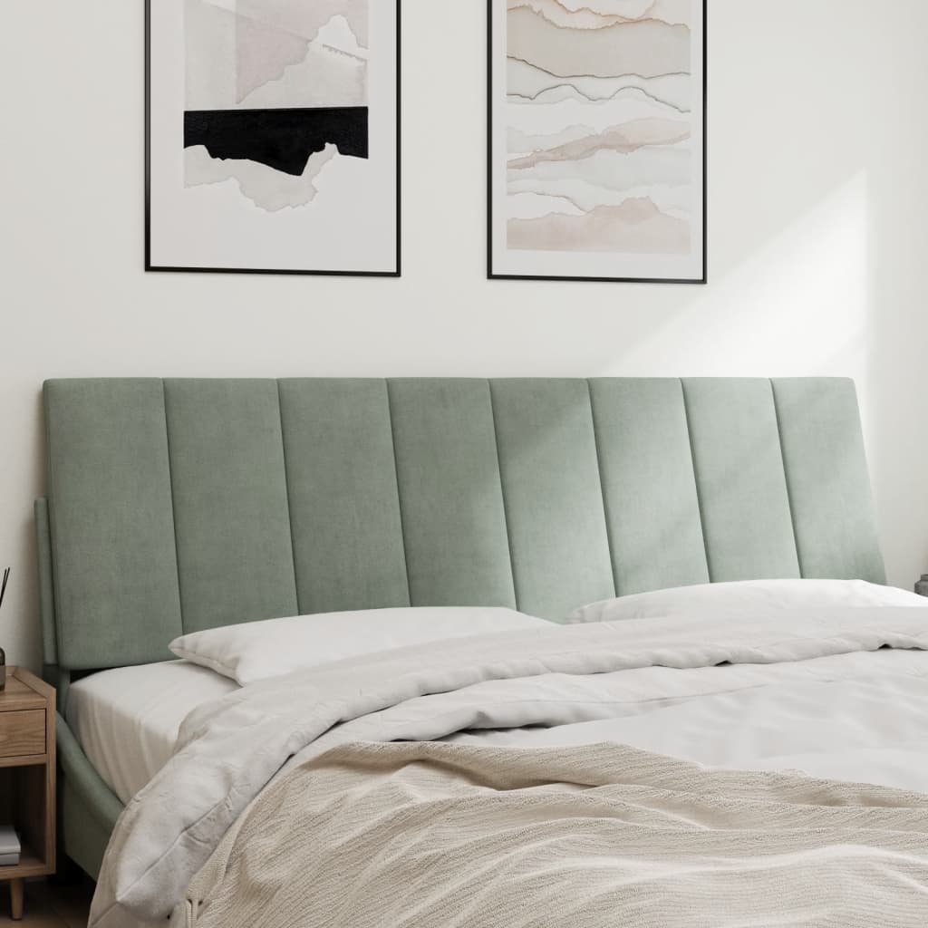 Light grey upholstered headboard with vertical channel tufting
