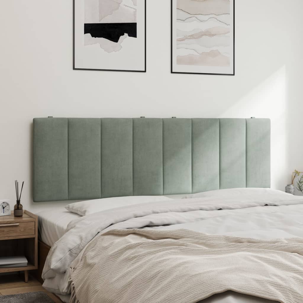 Sage green upholstered headboard with vertical channel tufting