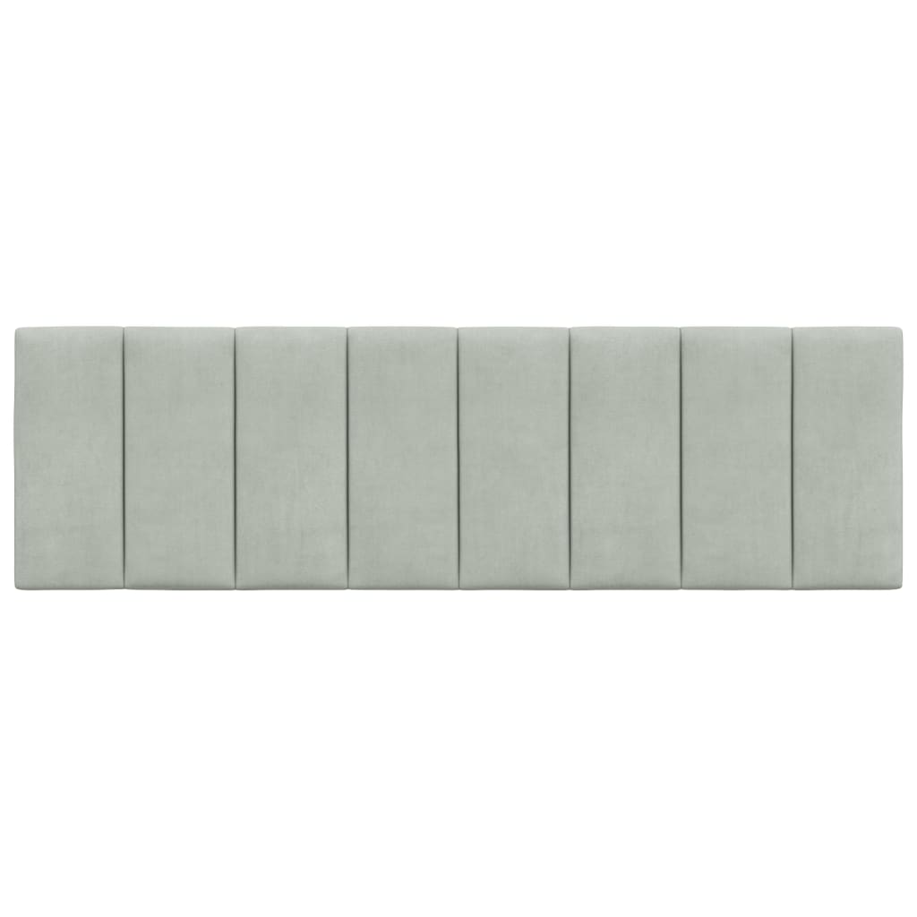 Sage green upholstered headboard with vertical paneling