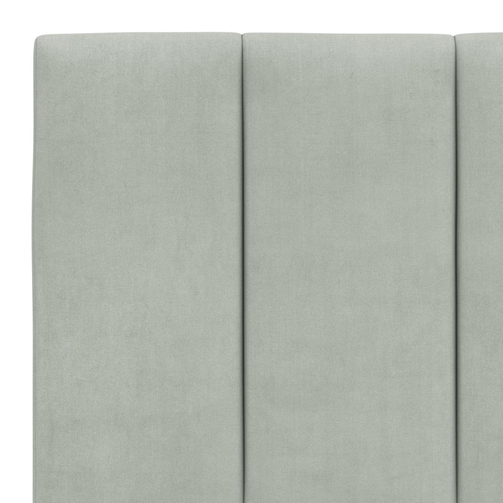 Light gray upholstered headboard with multiple hanging loops