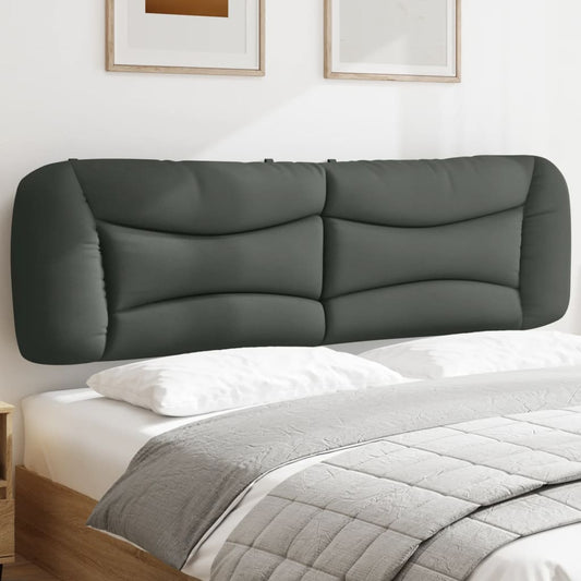 Upholstered headboard in a dark gray fabric with a modern curved design
