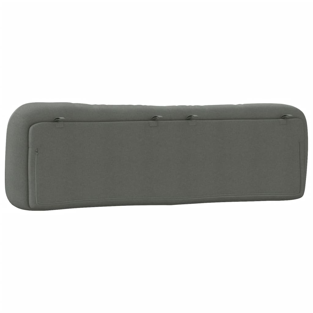 Deep grey upholstered headboard with tufted cushions